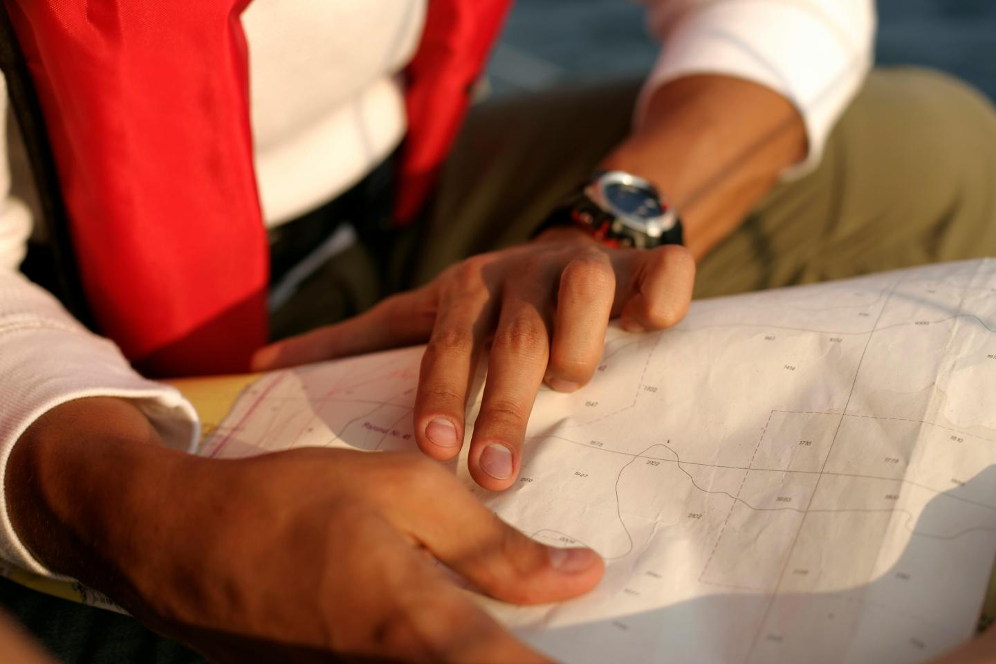 Using a paper chart to navigate on the water