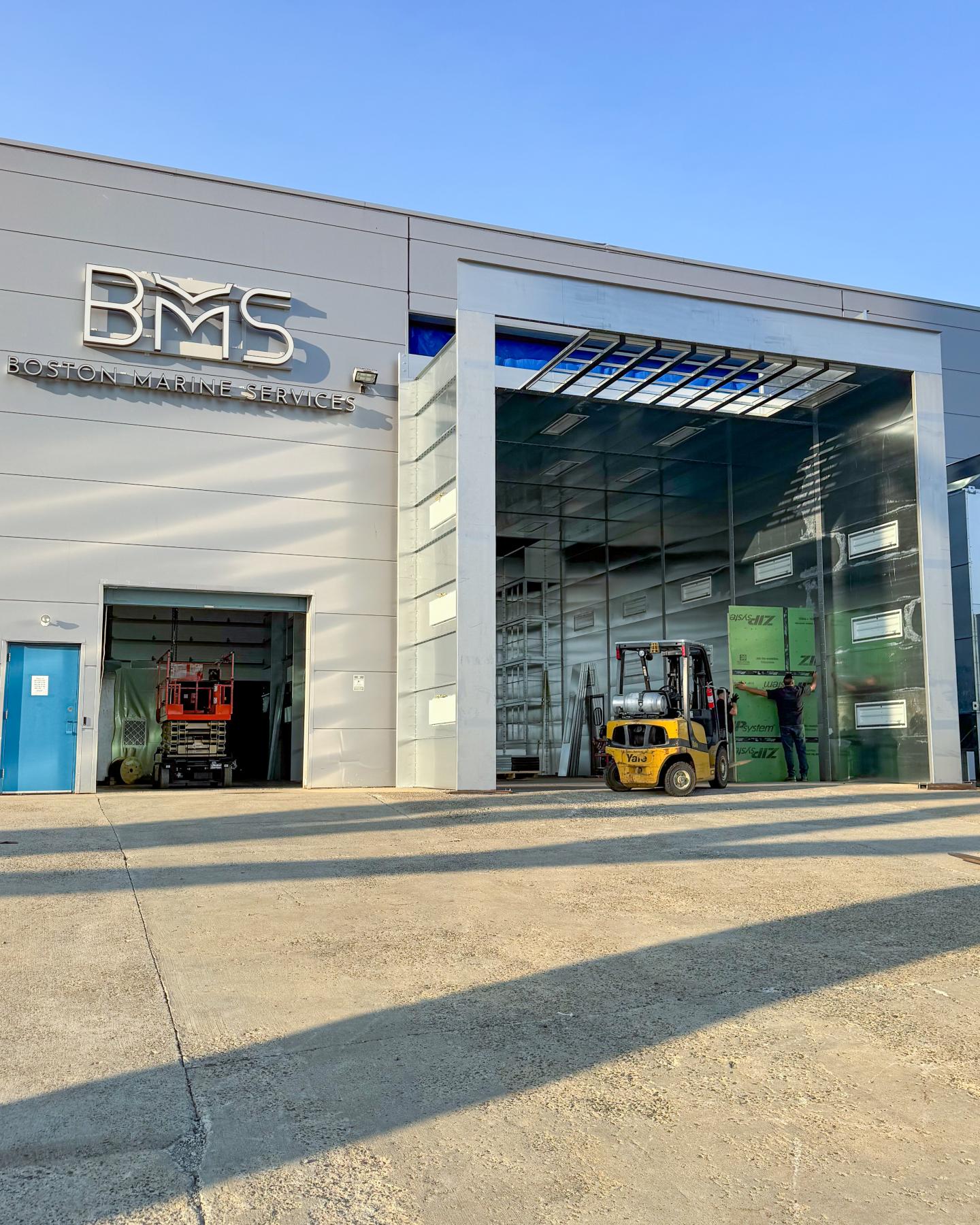 Installation of a professional paint booth at Boston Marine Services.